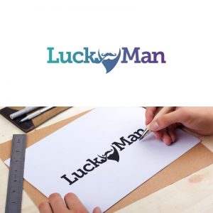 Lucky man logo being drawn on paper with a pen by the hands of one of the Repeat Logo designers.